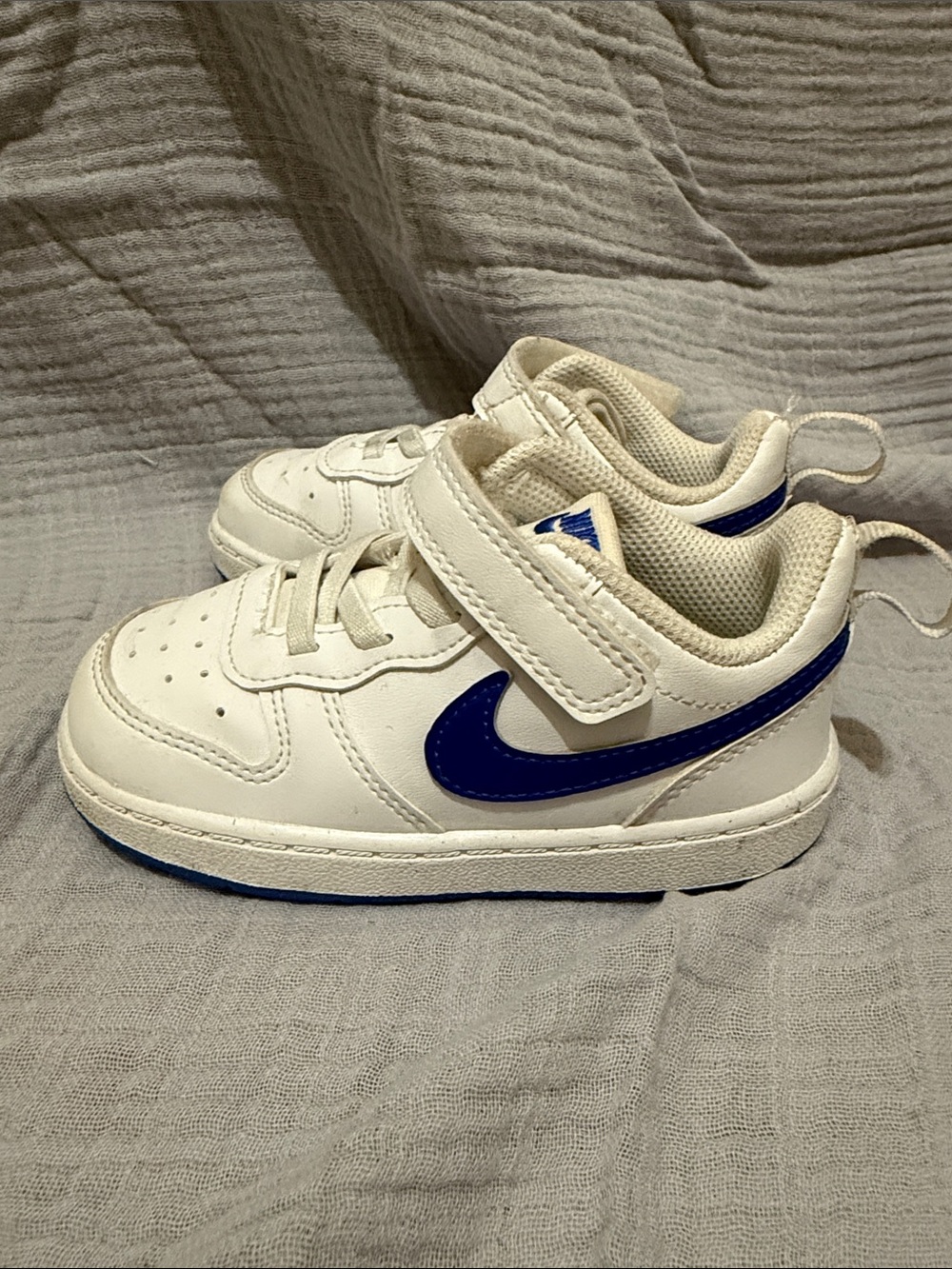 Nike Kids White Sneakers with Blue Swoosh